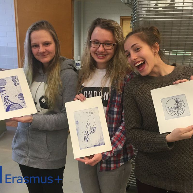 Students presenting art prints